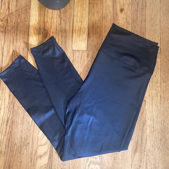 Pants - Black coated leggings.